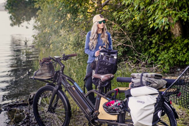 A person standing beside a bike
