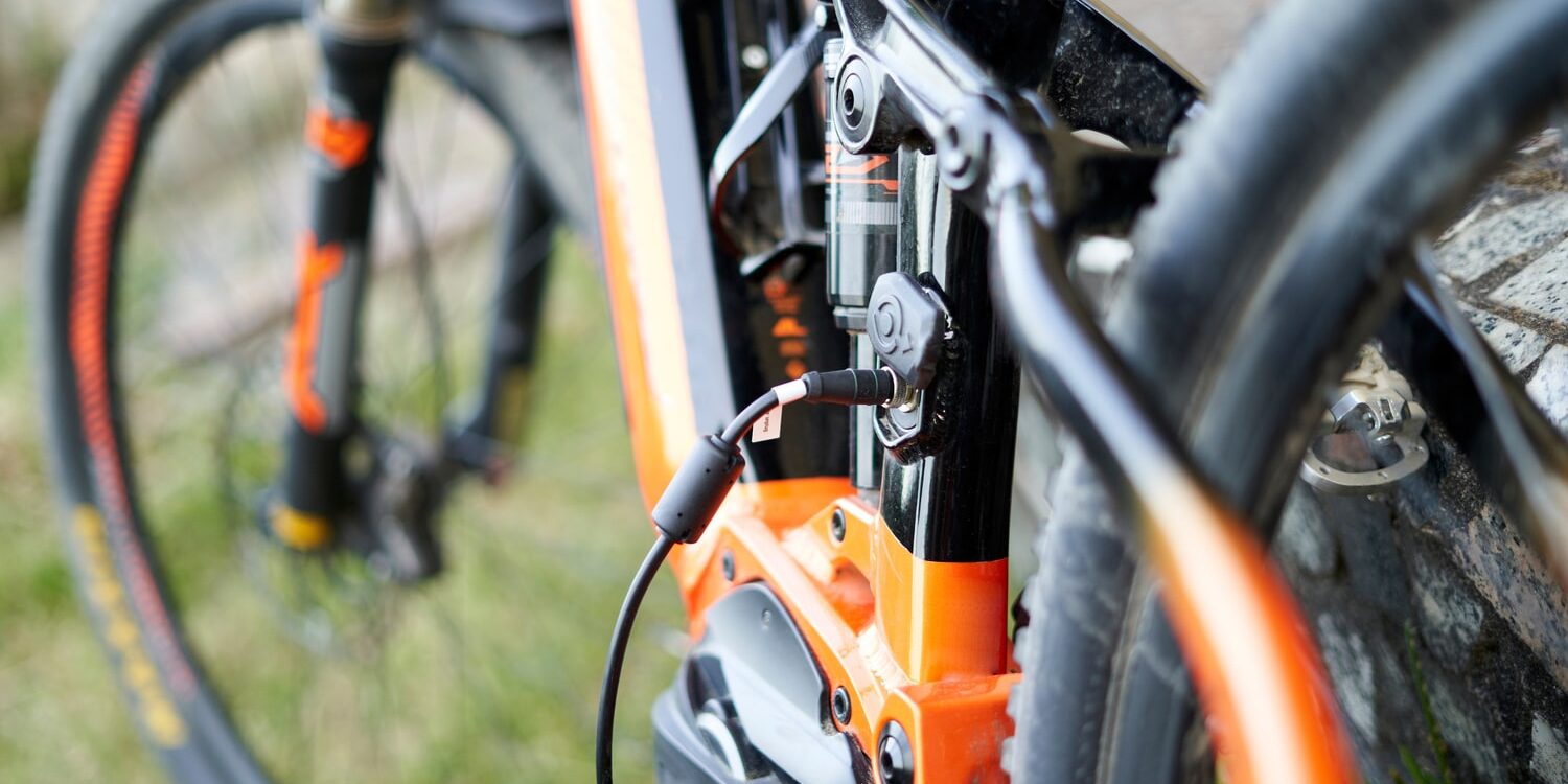 close-up-of-an-electric-bike-plugged-in-charging-2022-08-16-19-15-09-utc (1)-min how do electric bikes work , venice fl